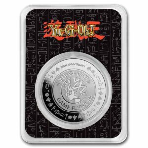 Yu gi oh moneda de plata 2022 con el diseño del rostro del personaje principal al centro y la frase: 25th aniversary.