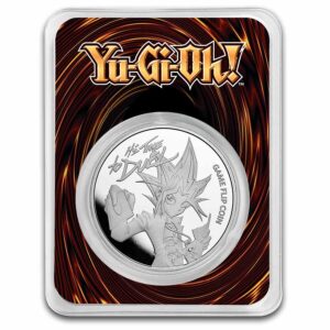 Yu gi oh moneda de plata 2023 con el diseño del personaje principal y la frase: it's time to duel.