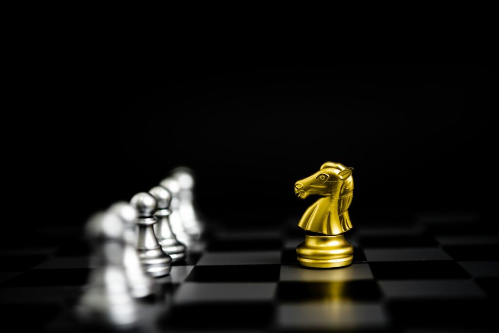 Chess game gold and silver on black background.